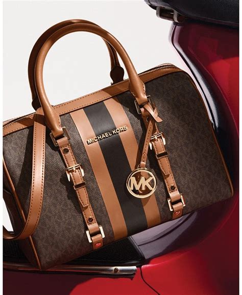 michael kors duffle bag gold|Michael Kors travel suitcase.